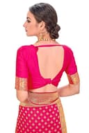 Woman wearing a red party wear ethnic kurta style by Nishtha Chadda