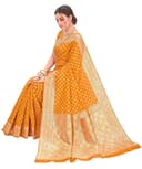 Woman wearing a orange party wear ethnic kurta style by Nishtha Chadda