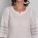 Woman wearing a grey party wear ethnic kurta style by Nishtha Chadda