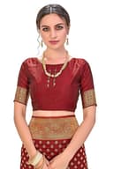 Woman wearing a maroon party wear ethnic kurta style by Nishtha Chadda