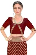 Woman wearing a maroon party wear ethnic kurta style by Nishtha Chadda