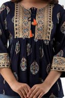 Woman wearing a brown party wear ethnic kurta style by Nishtha Chadda