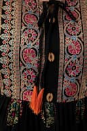 Woman wearing a maroon party wear ethnic kurta style by Nishtha Chadda