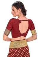 Woman wearing a maroon party wear ethnic kurta style by Nishtha Chadda