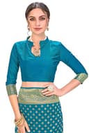 Woman wearing a teal party wear ethnic kurta style by Nishtha Chadda