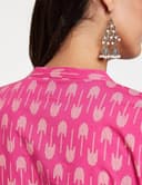 Woman wearing a pink party wear ethnic kurta style by Nishtha Chadda