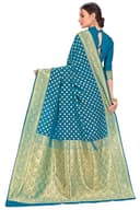 Woman wearing a teal party wear ethnic kurta style by Nishtha Chadda