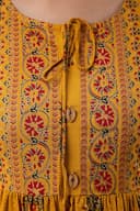 Woman wearing a orange party wear ethnic kurta style by Nishtha Chadda