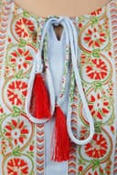 Woman wearing a red indian kurti for women by Nishtha Chadda