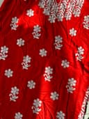 Woman wearing a red embroidered kurti set by Nishtha Chadda