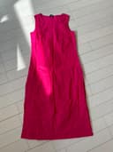 Woman wearing a red embroidered kurti set by Nishtha Chadda