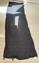 Woman wearing a black embroidered kurti set by Nishtha Chadda