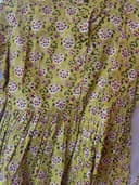 Woman wearing a olive embroidered kurti set by Nishtha Chadda