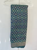 Woman wearing a navy embroidered kurti set by Nishtha Chadda