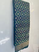 Woman wearing a navy embroidered kurti set by Nishtha Chadda