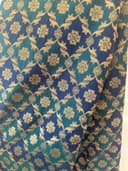 Woman wearing a navy embroidered kurti set by Nishtha Chadda