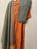 Woman wearing a brown embroidered kurti set by Nishtha Chadda