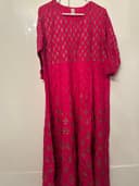 Woman wearing a brown embroidered kurti set by Nishtha Chadda