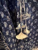 Woman wearing a navy embroidered kurti set by Nishtha Chadda