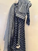 Woman wearing a navy embroidered kurti set by Nishtha Chadda