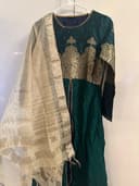 Woman wearing a navy embroidered kurti set by Nishtha Chadda