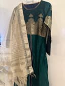 Woman wearing a black embroidered kurti set by Nishtha Chadda
