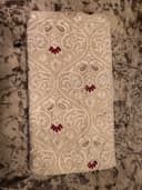 Woman wearing a brown embroidered kurti set by Nishtha Chadda