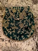 Woman wearing a black embroidered kurti set by Nishtha Chadda
