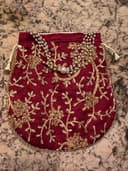 Woman wearing a red embroidered kurti set by Nishtha Chadda