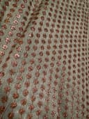Woman wearing a brown embroidered kurti set by Nishtha Chadda