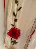 Woman wearing a maroon embroidered kurti set by Nishtha Chadda