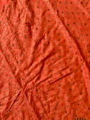 Woman wearing a maroon embroidered kurti set by Nishtha Chadda