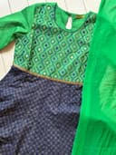 Woman wearing a maroon embroidered kurti set by Nishtha Chadda