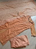 Woman wearing a brown embroidered kurti set by Nishtha Chadda