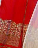 Woman wearing a red embroidered kurti set by Nishtha Chadda