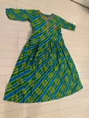 Woman wearing a navy embroidered kurti set by Nishtha Chadda