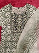 Woman wearing a red embroidered kurti set by Nishtha Chadda