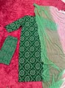Woman wearing a maroon embroidered kurti set by Nishtha Chadda