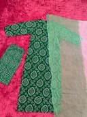 Woman wearing a maroon embroidered kurti set by Nishtha Chadda