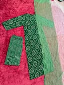 Woman wearing a maroon embroidered kurti set by Nishtha Chadda