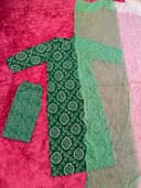 Woman wearing a maroon embroidered kurti set by Nishtha Chadda