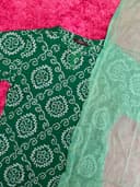 Woman wearing a maroon embroidered kurti set by Nishtha Chadda