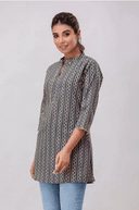 Woman wearing a grey indian kurti for women by Nishtha Chadda