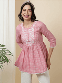 Woman wearing a grey indian kurti for women by Nishtha Chadda
