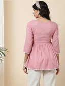 Woman wearing a grey indian kurti for women by Nishtha Chadda