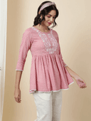 Woman wearing a grey indian kurti for women by Nishtha Chadda
