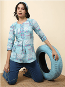 Woman wearing a olive indian kurti for women by Nishtha Chadda