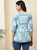 Woman wearing a olive indian kurti for women by Nishtha Chadda