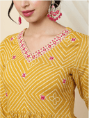 Woman wearing a red indian kurti for women by Nishtha Chadda