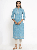 Woman wearing a grey indian kurti for women by Nishtha Chadda